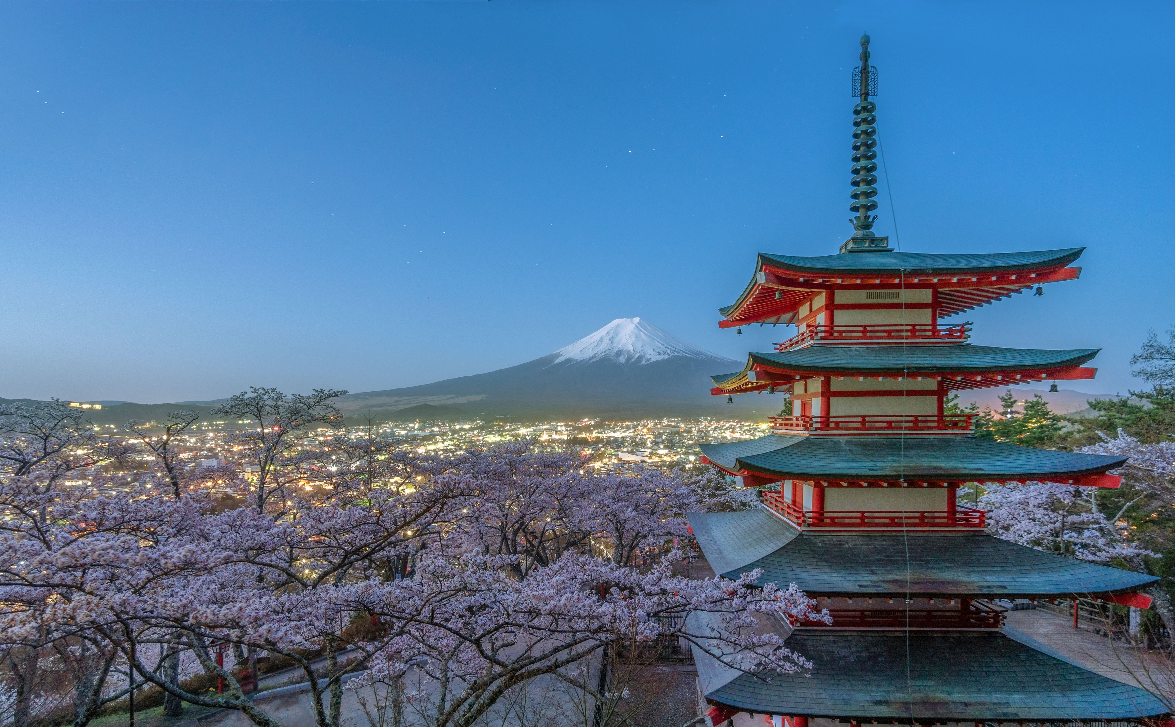Red autumn maple leaf by pagoda Kiyomizu-dera at sunset, Kyoto