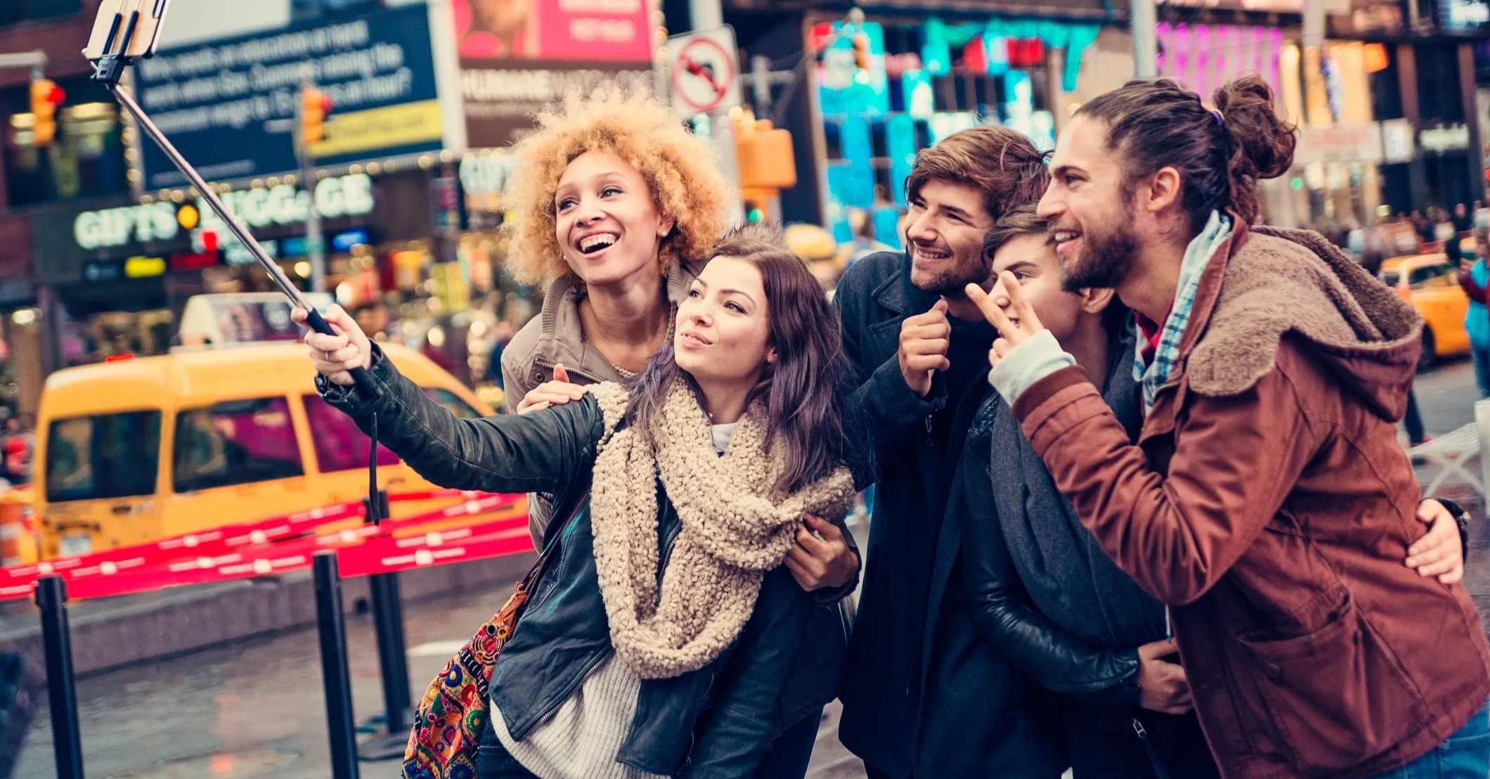Diverse group of friends celebrating a night out in the city