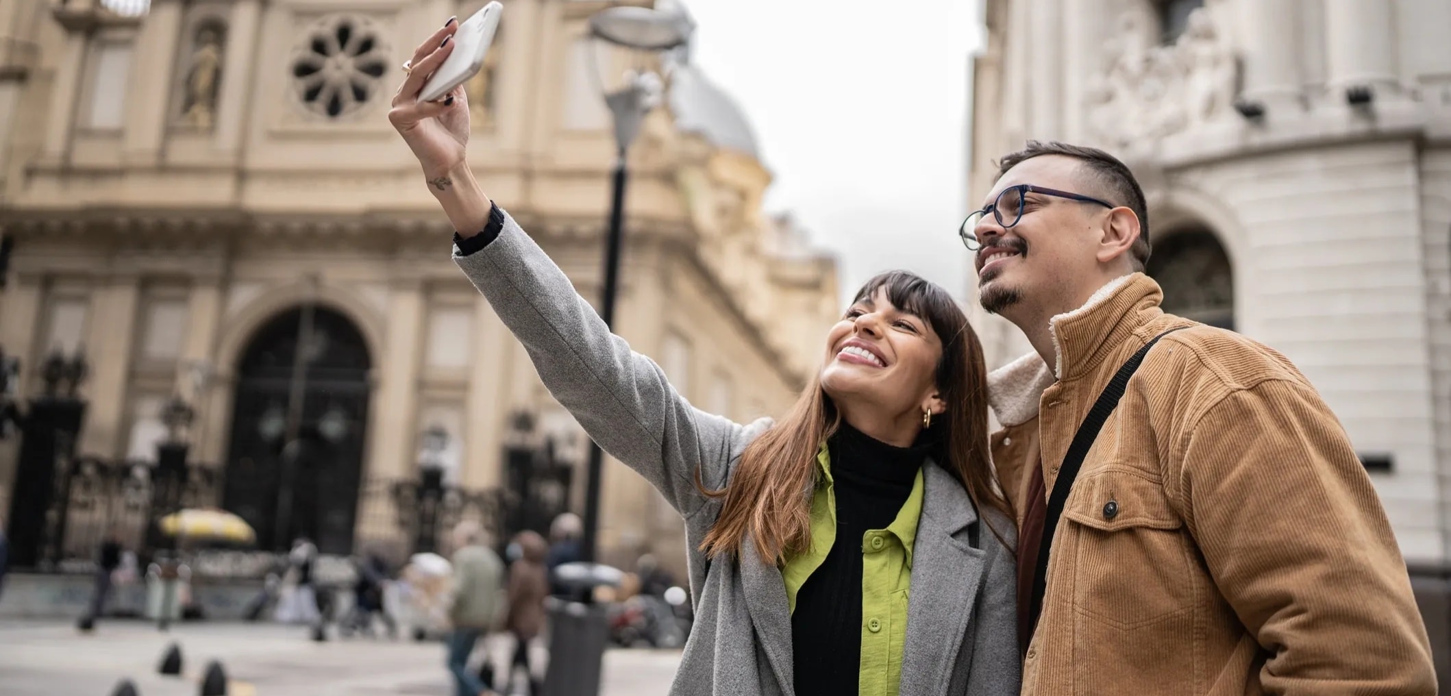 Happy couple exploring an ancient European city together