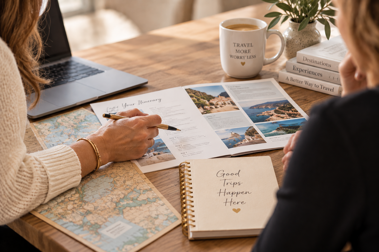 Travel planning materials including passport, notebook and map laid out on a warm wooden table